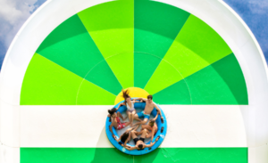 people in a tube sliding around at hashtag heights