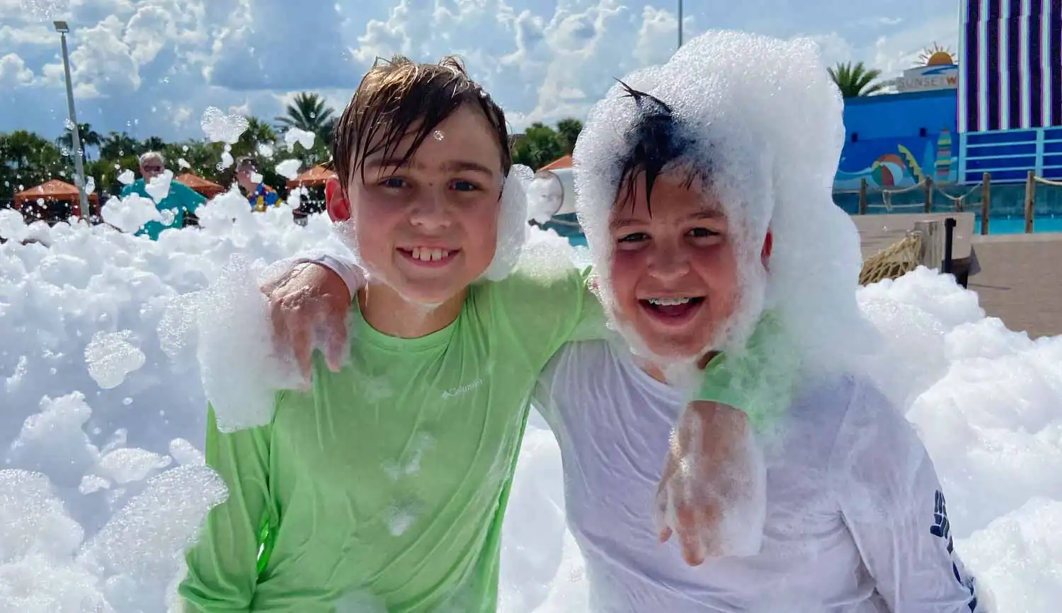 Dad and son splashing in a pool
