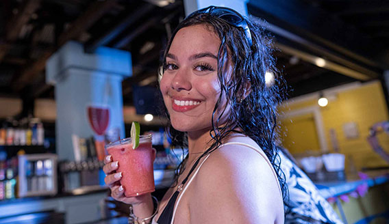 lady-with-drink-1 Riders speeding down mat racer slide